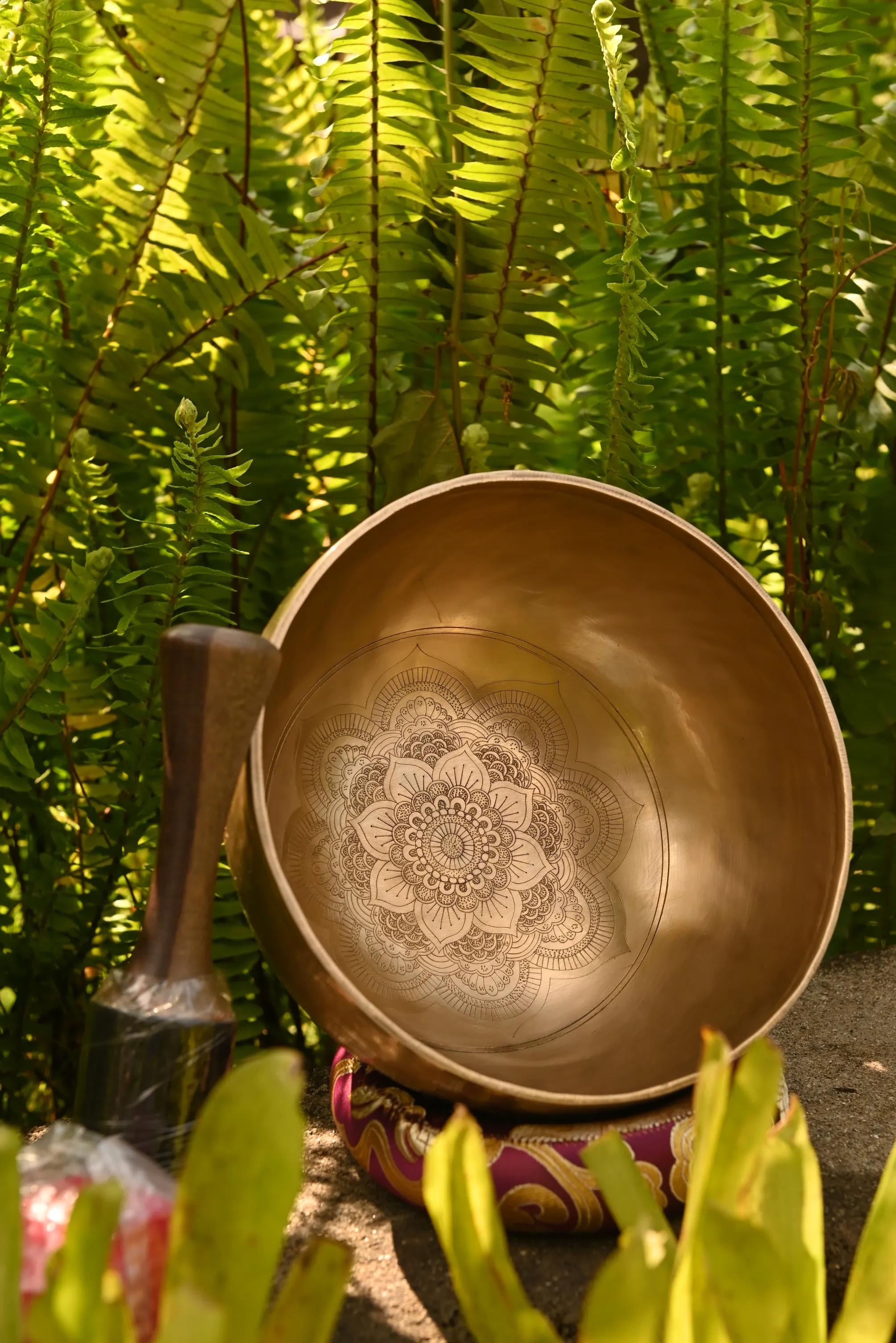Hand-engraved Tibetan singing bowl with a lotus mandala design
