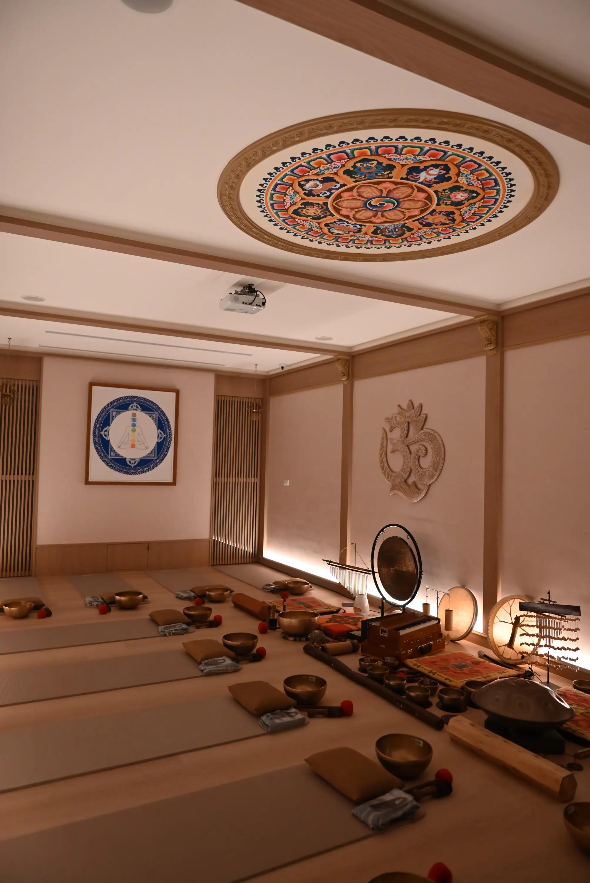 Sound healing studio with gong, handpan, and singing bowls setup